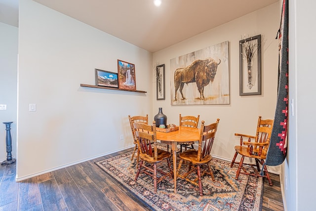 dining area featuring wood finished floors and baseboards