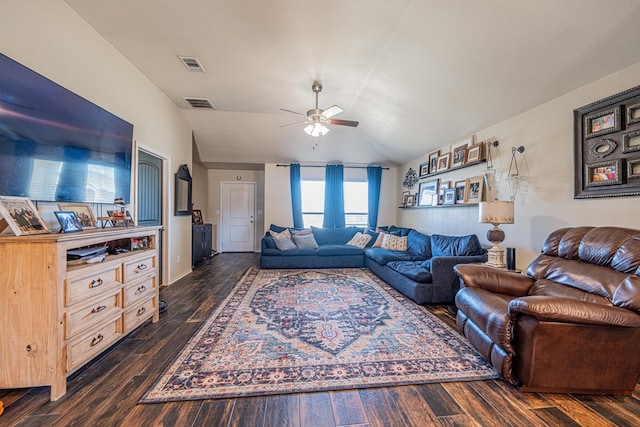 living area with visible vents, a ceiling fan, lofted ceiling, and dark wood-style flooring