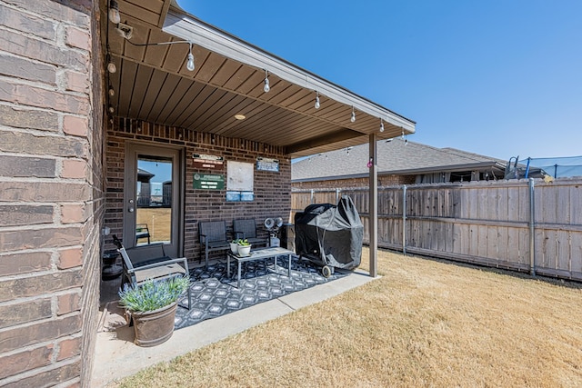 view of patio featuring fence