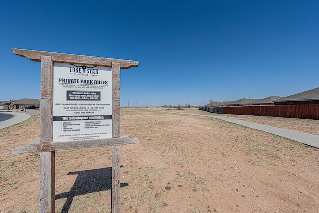 view of community with fence