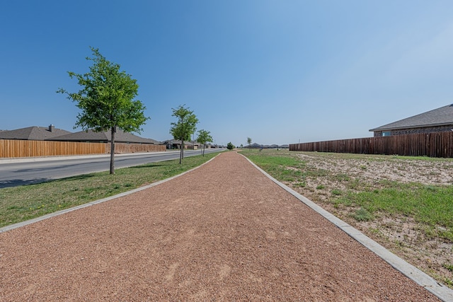 view of property's community featuring fence