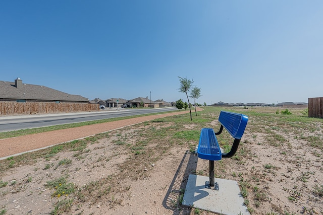 view of home's community with fence