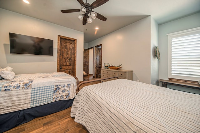 bedroom featuring ceiling fan and wood-type flooring