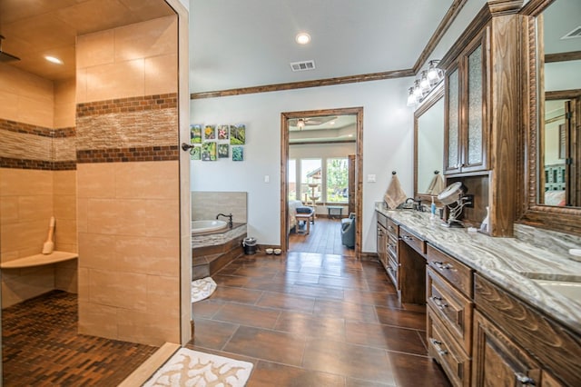 bathroom featuring vanity, independent shower and bath, and ornamental molding