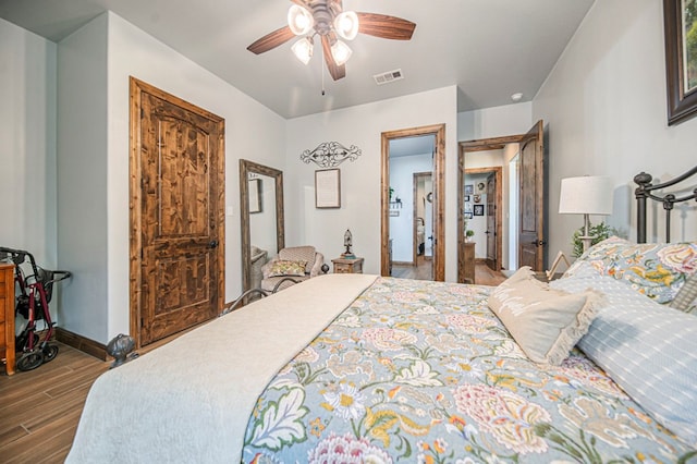 bedroom with wood-type flooring and ceiling fan