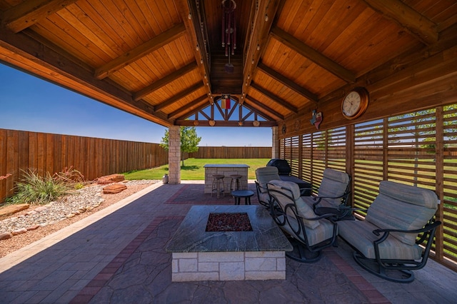 view of patio / terrace with an outdoor fire pit