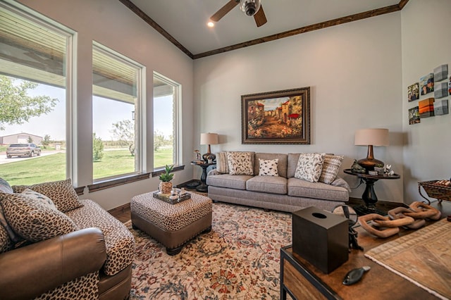 living room featuring ceiling fan and crown molding