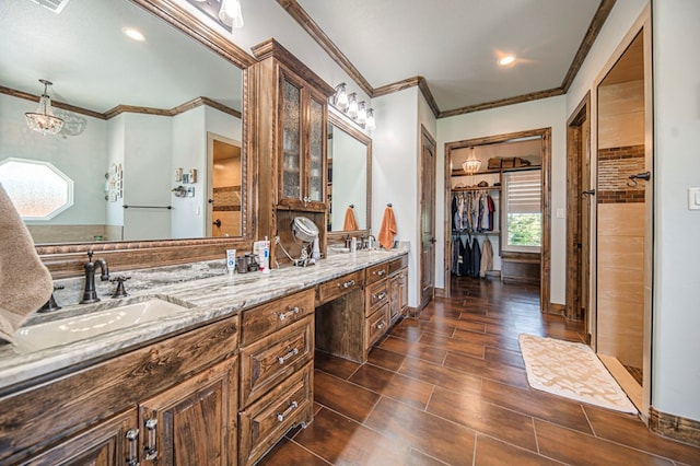 bathroom with vanity, walk in shower, and crown molding