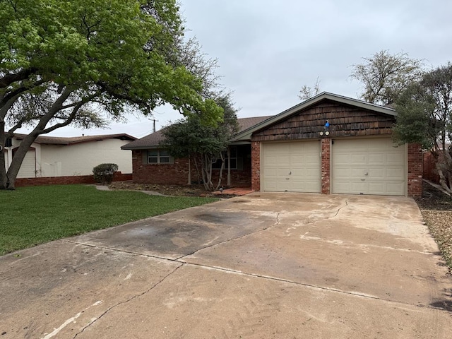 ranch-style house with a front yard, an attached garage, brick siding, and driveway