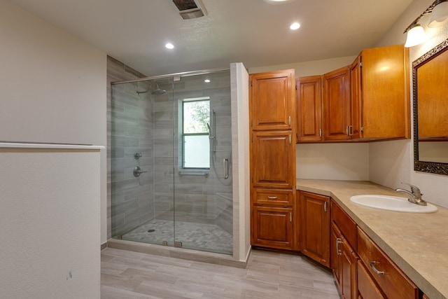 2100 Edgemere Rd, Big Spring, TX 79720 - full bathroom featuring vanity, recessed lighting, and a stall shower