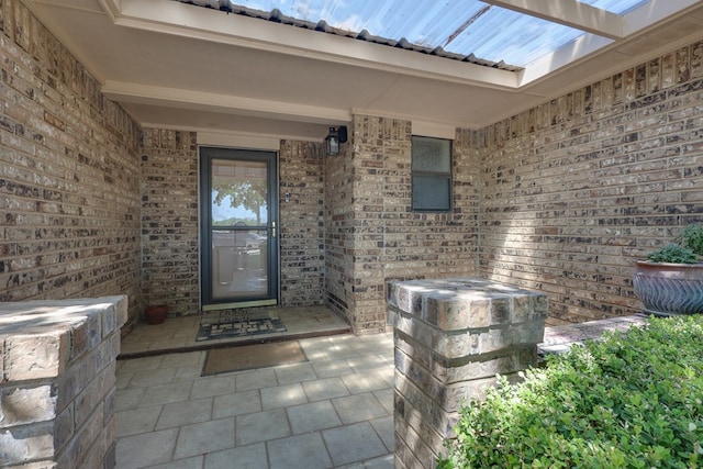 2100 Edgemere Rd, Big Spring, TX 79720 - view of exterior entry featuring a patio area and brick siding
