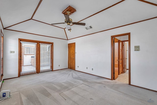 carpeted spare room featuring baseboards, visible vents, high vaulted ceiling, and a ceiling fan