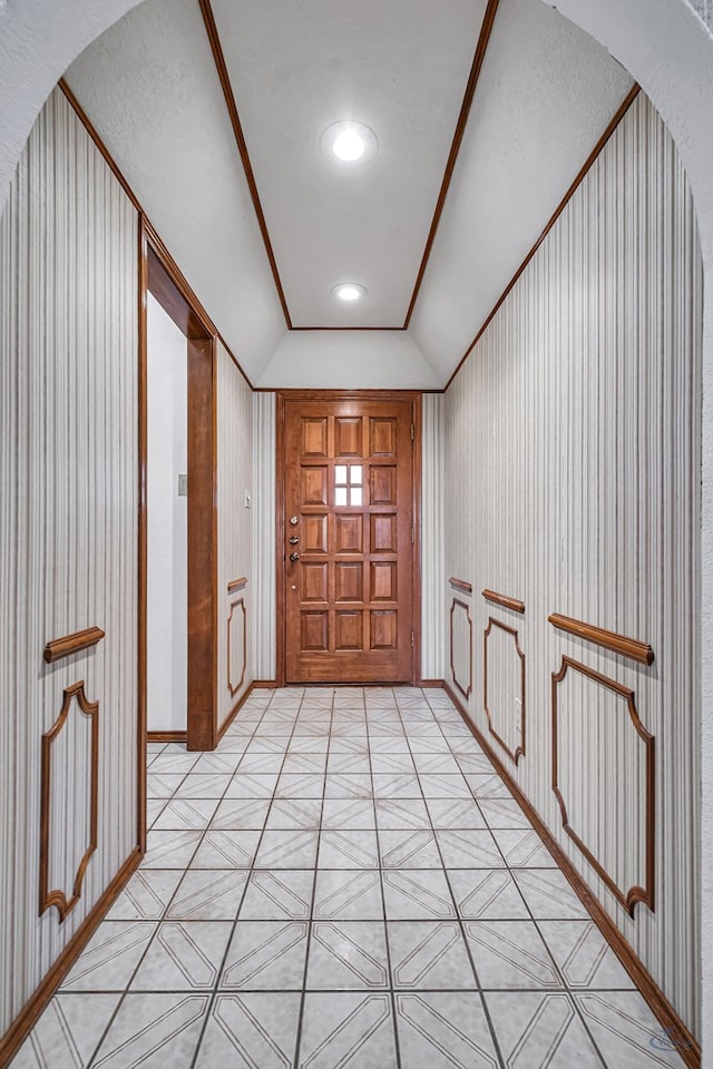 entrance foyer featuring recessed lighting, lofted ceiling, and arched walkways