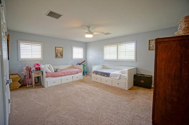 bedroom featuring carpet and a ceiling fan