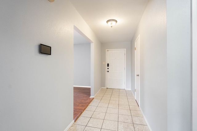 hallway with light tile patterned flooring