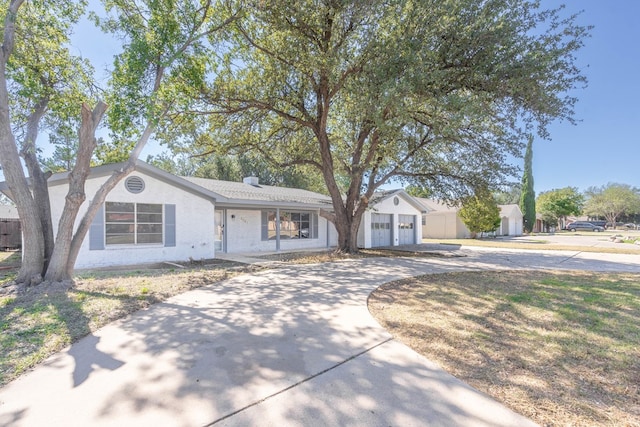 ranch-style house featuring a garage