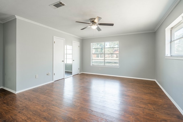 unfurnished room featuring crown molding, ceiling fan, dark hardwood / wood-style flooring, and a healthy amount of sunlight