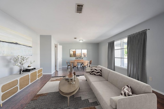 living room featuring dark wood-type flooring