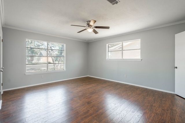 empty room with a wealth of natural light, ceiling fan, dark hardwood / wood-style floors, and ornamental molding