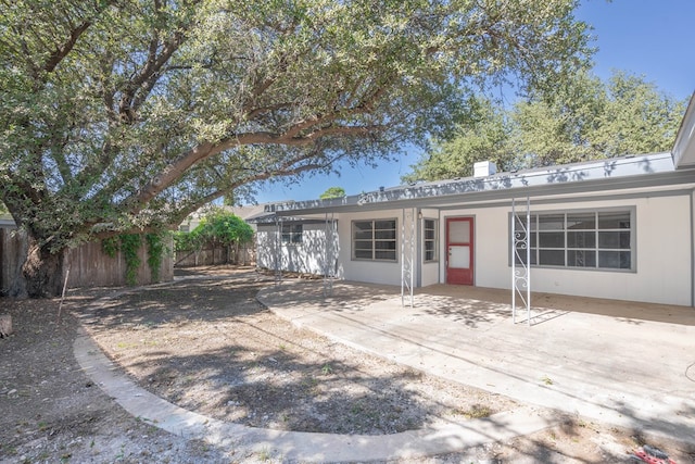 ranch-style home with a patio