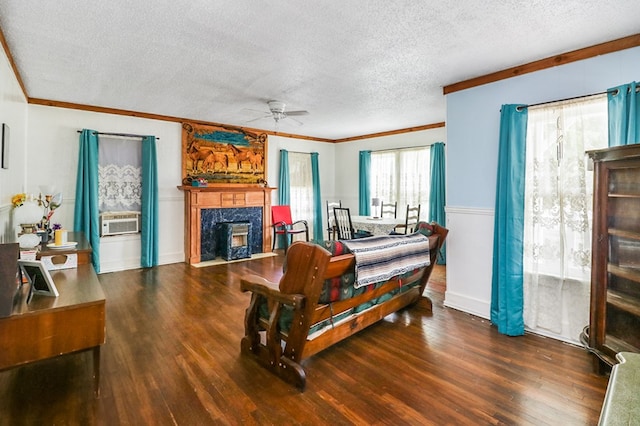 605 W Walnut St, Coleman, TX 76834 - bedroom with a textured ceiling, crown molding, wood finished floors, a fireplace, and cooling unit