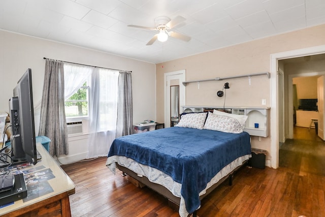 605 W Walnut St, Coleman, TX 76834 - bedroom with hardwood / wood-style floors and a ceiling fan