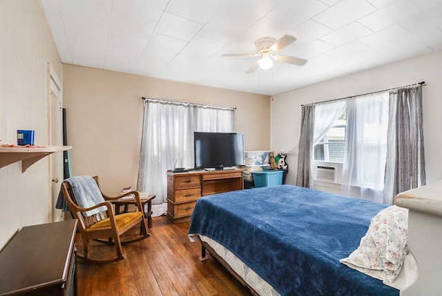 605 W Walnut St, Coleman, TX 76834 - bedroom with wood-type flooring and ceiling fan