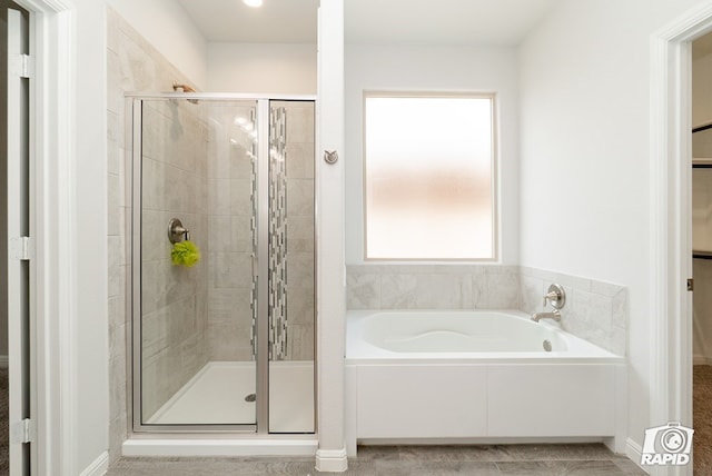 full bath with a garden tub and a shower stall