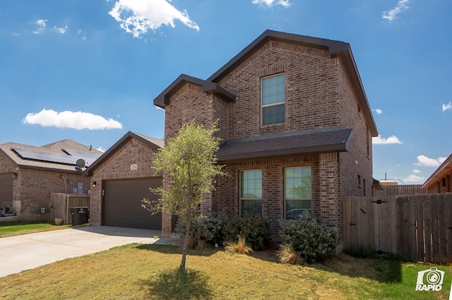 traditional home with brick siding, an attached garage, fence, and driveway