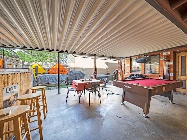 recreation room with concrete flooring and billiards