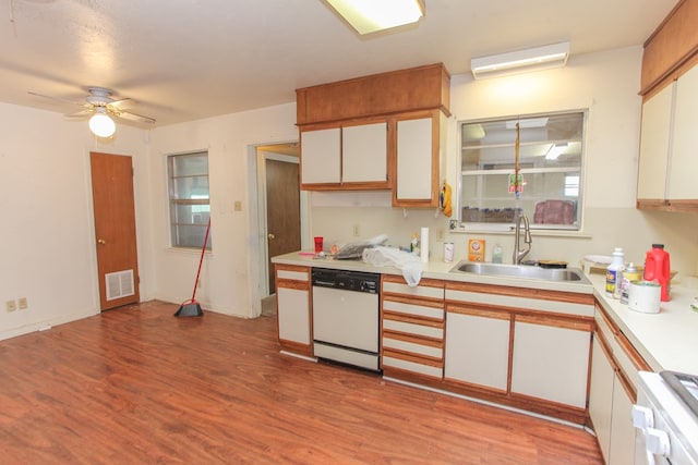 kitchen featuring sink, white cabinets, white appliances, and light hardwood / wood-style flooring