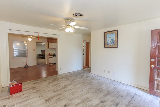 unfurnished living room featuring light hardwood / wood-style floors and ceiling fan