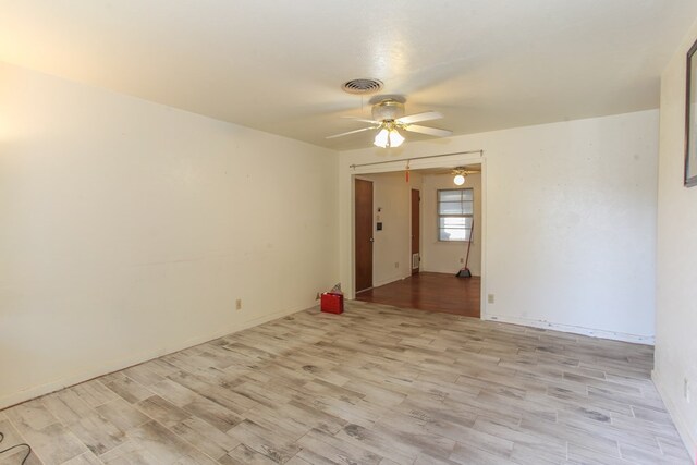 unfurnished room with light hardwood / wood-style floors and ceiling fan