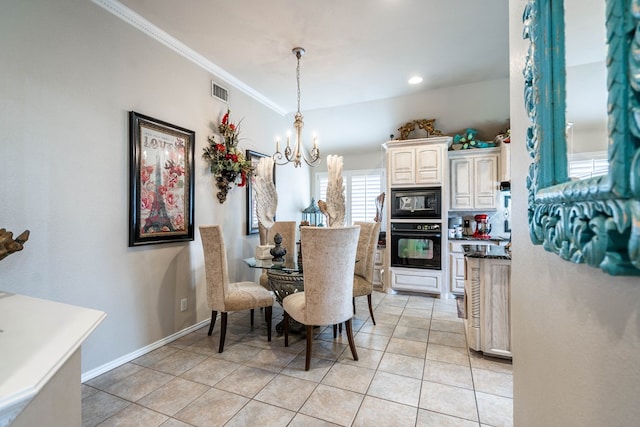 dining room with ornamental molding, light tile patterned floors, and a chandelier