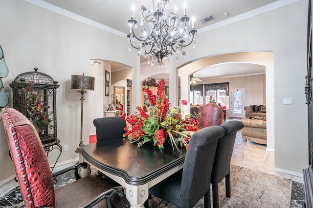 dining space with ornamental molding and ceiling fan