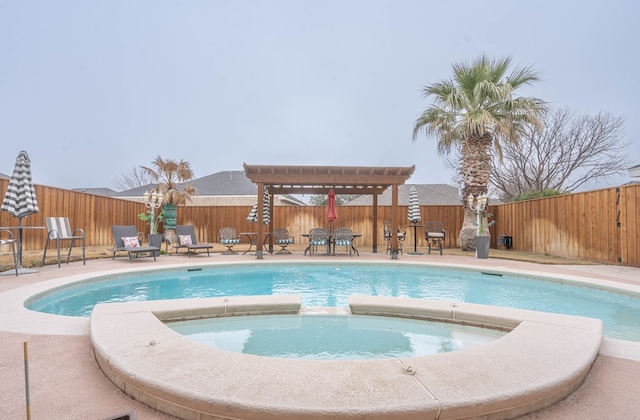 view of pool featuring an in ground hot tub