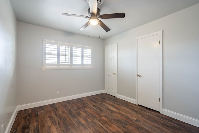 unfurnished bedroom with dark wood-type flooring and ceiling fan