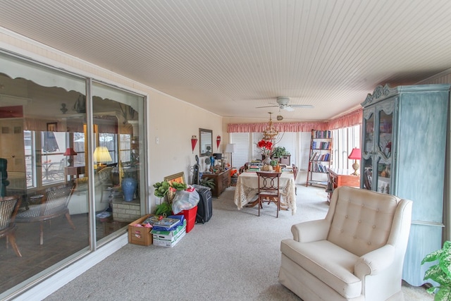 sunroom / solarium with a ceiling fan