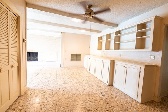 1001 W Walnut St, Coleman, TX 76834 - hall featuring a textured ceiling and light flooring