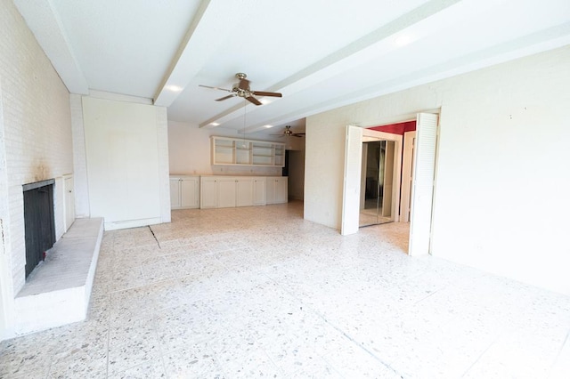 1001 W Walnut St, Coleman, TX 76834 - unfurnished living room featuring a brick fireplace and a ceiling fan