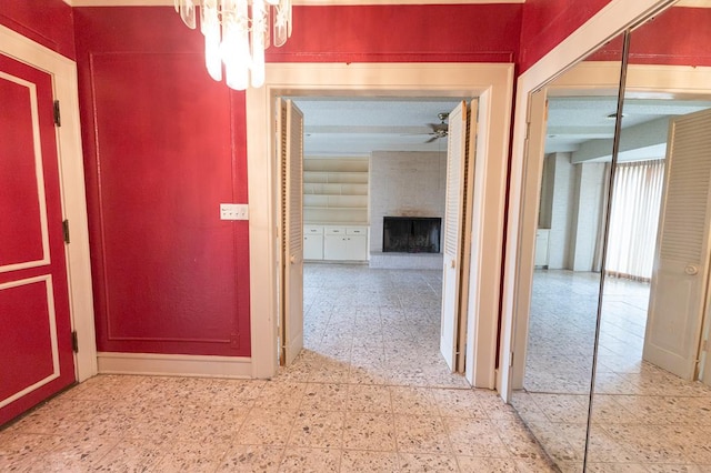 1001 W Walnut St, Coleman, TX 76834 - corridor featuring a chandelier
