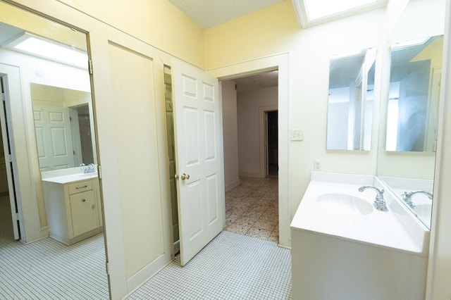 1001 W Walnut St, Coleman, TX 76834 - bathroom featuring vanity and tile patterned floors