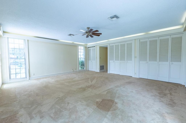 1001 W Walnut St, Coleman, TX 76834 - carpeted empty room featuring a ceiling fan
