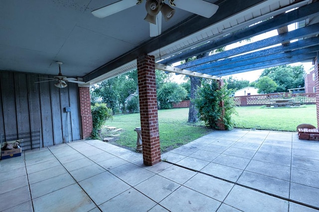 1001 W Walnut St, Coleman, TX 76834 - fenced backyard with ceiling fan, a patio, and a pergola