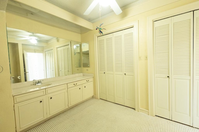 1001 W Walnut St, Coleman, TX 76834 - bathroom featuring a closet, ceiling fan, and vanity