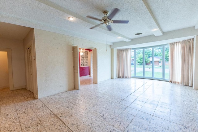 1001 W Walnut St, Coleman, TX 76834 - empty room with a ceiling fan, a textured ceiling, and a textured wall