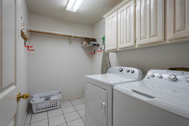 5411 Ridgemont Ct, Midland, TX 79707 - laundry room with independent washer and dryer, cabinet space, a textured ceiling, light tile patterned floors, and baseboards