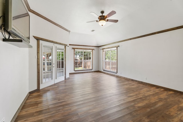 empty room featuring ceiling fan, french doors, dark wood-type flooring, and lofted ceiling