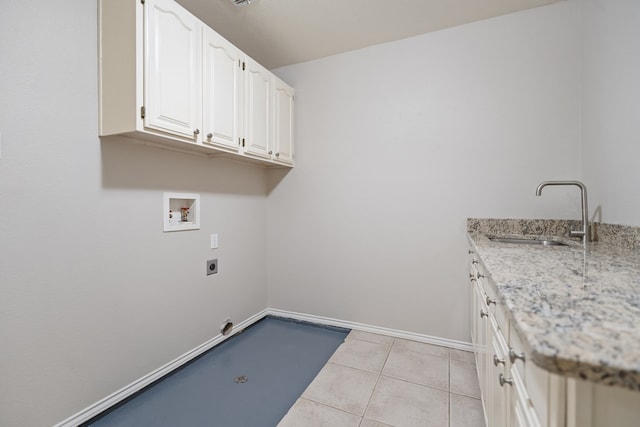 clothes washing area featuring sink, cabinets, hookup for an electric dryer, hookup for a washing machine, and light tile patterned floors