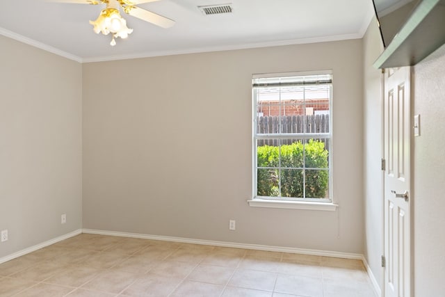 tiled spare room featuring ceiling fan and ornamental molding